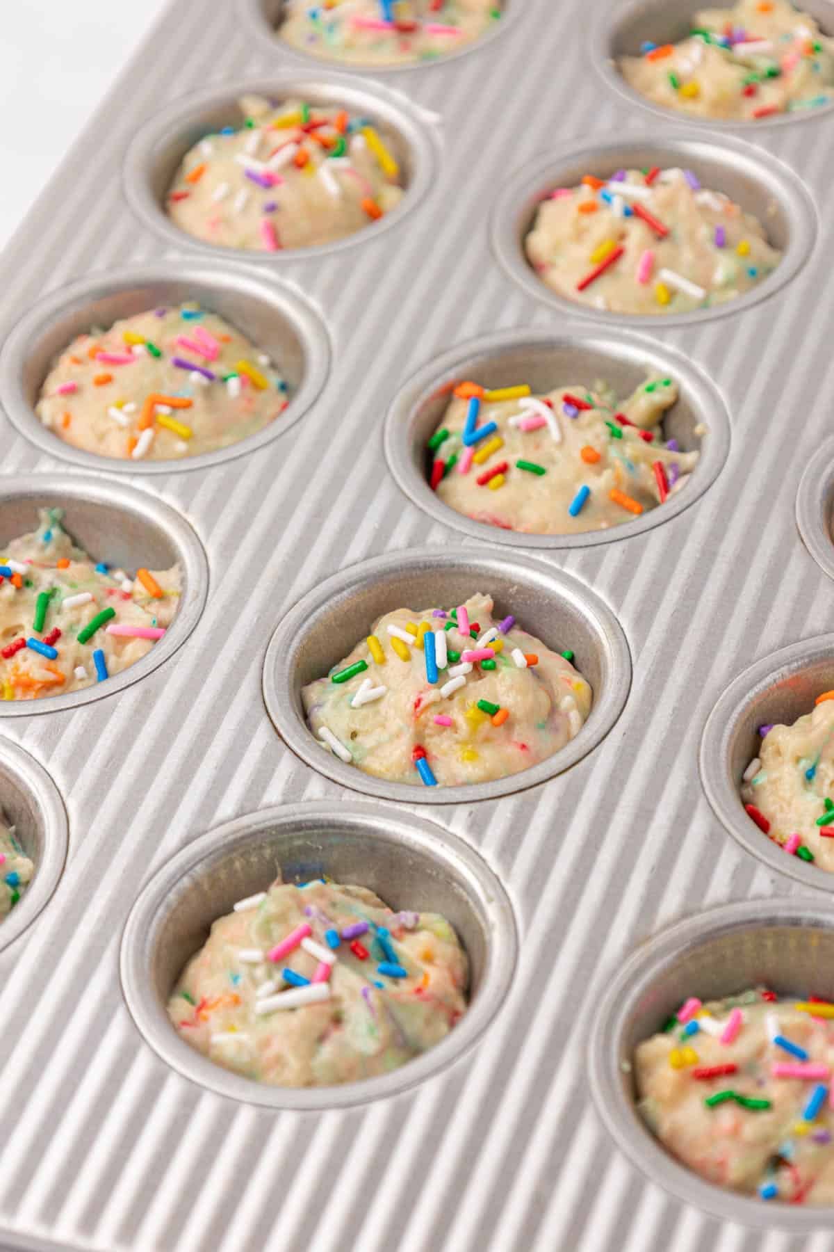 mini muffin tin filled with batter