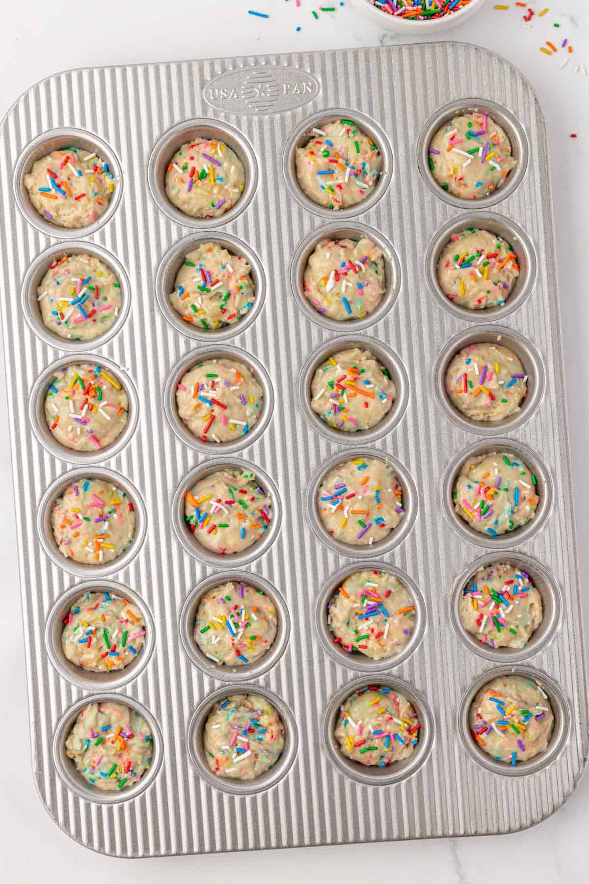 muffin tin filled with batter