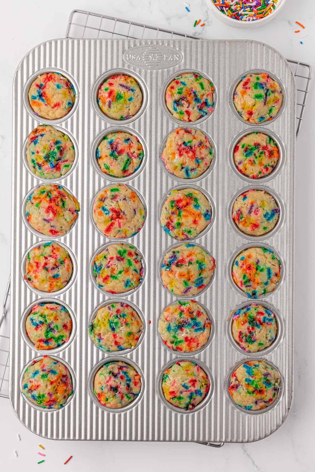 mini muffin tin with birthday cake mini muffins in it