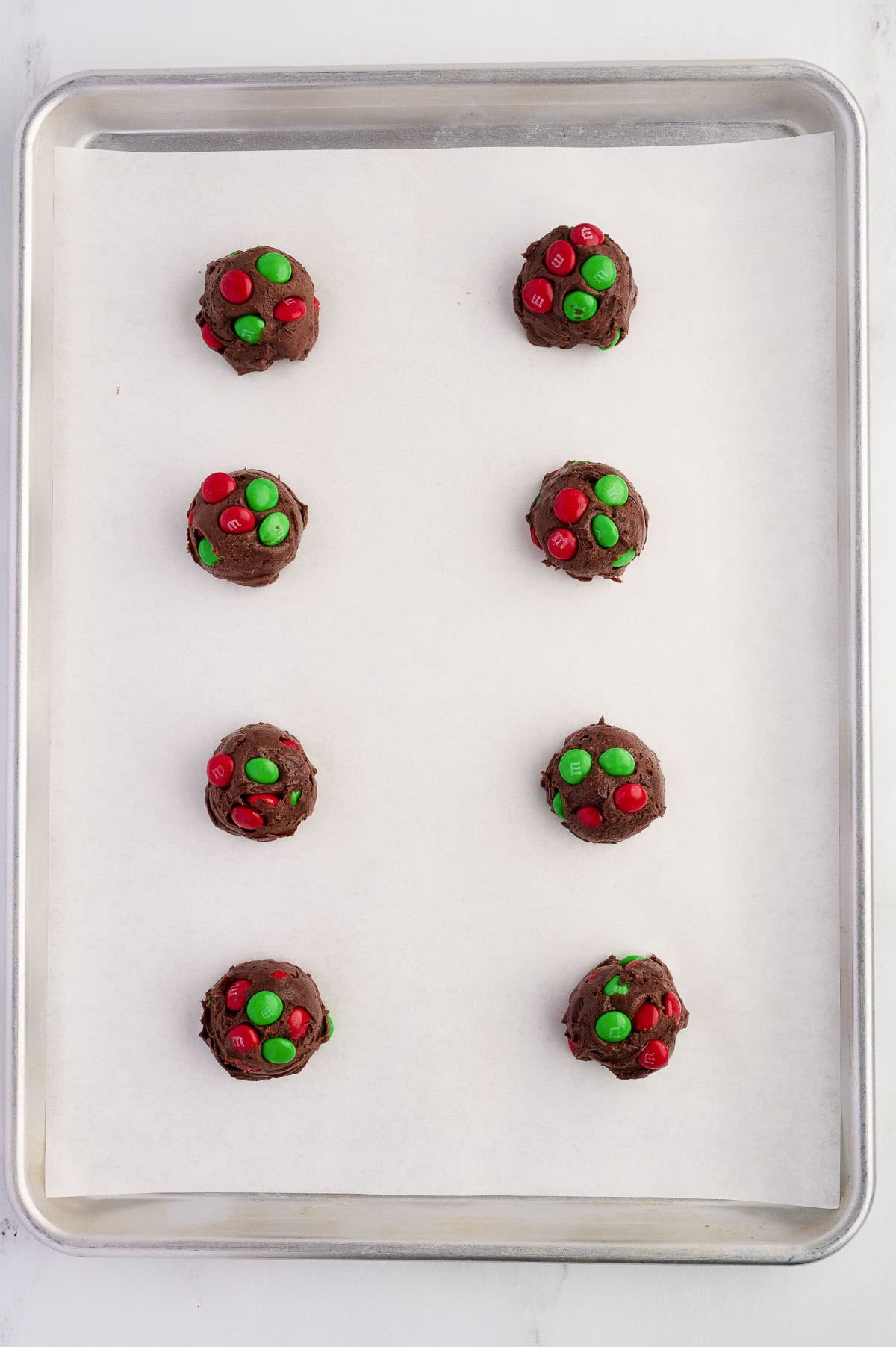 balls of batter on a baking sheet