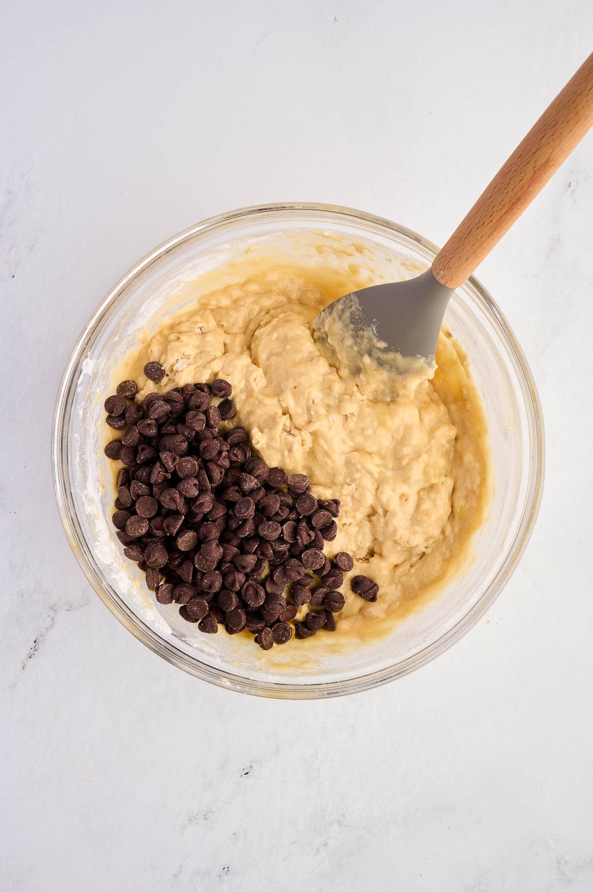 adding the chocolate chips to the batter