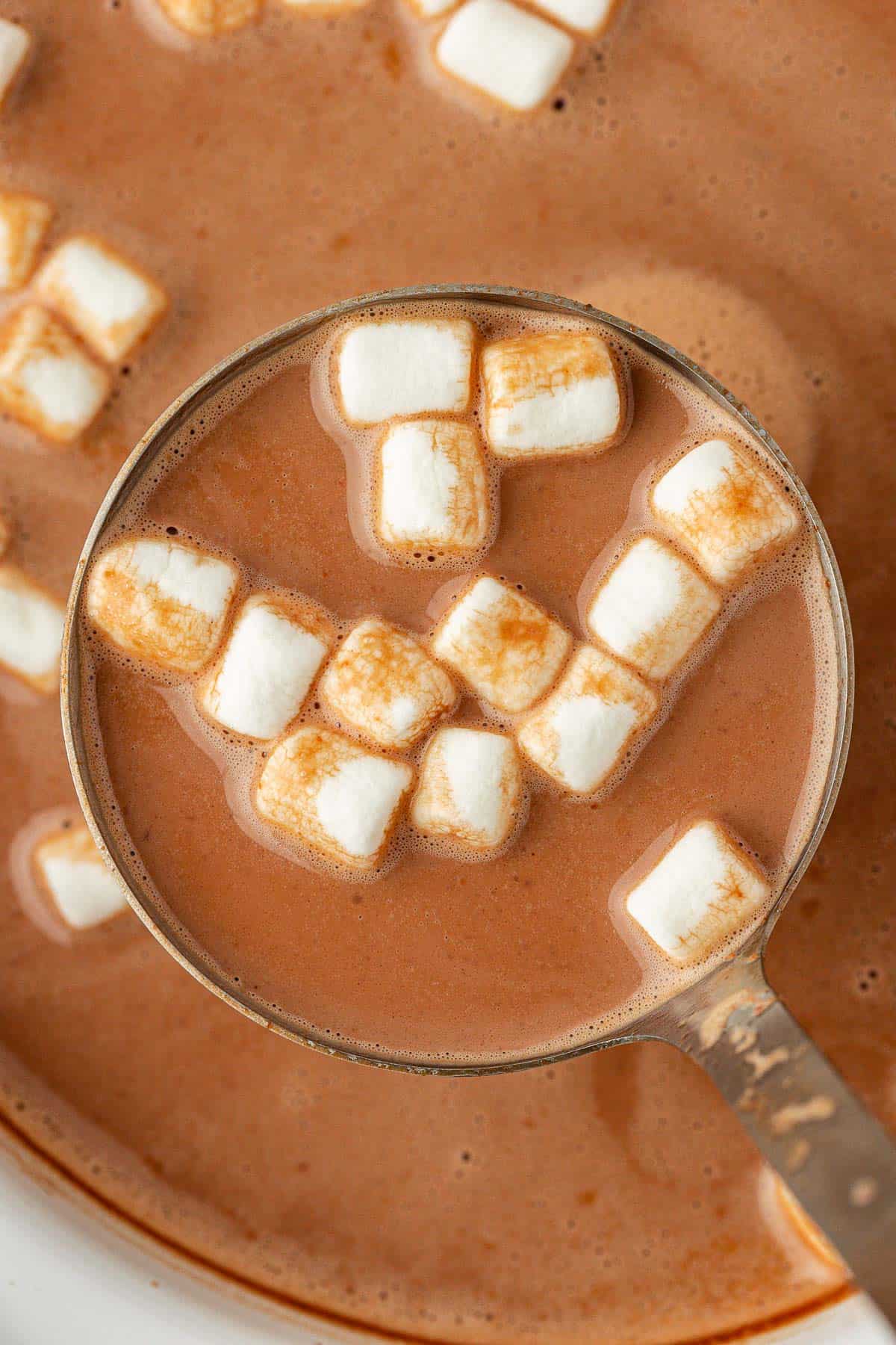 a ladle full of crock pot hot chocolate
