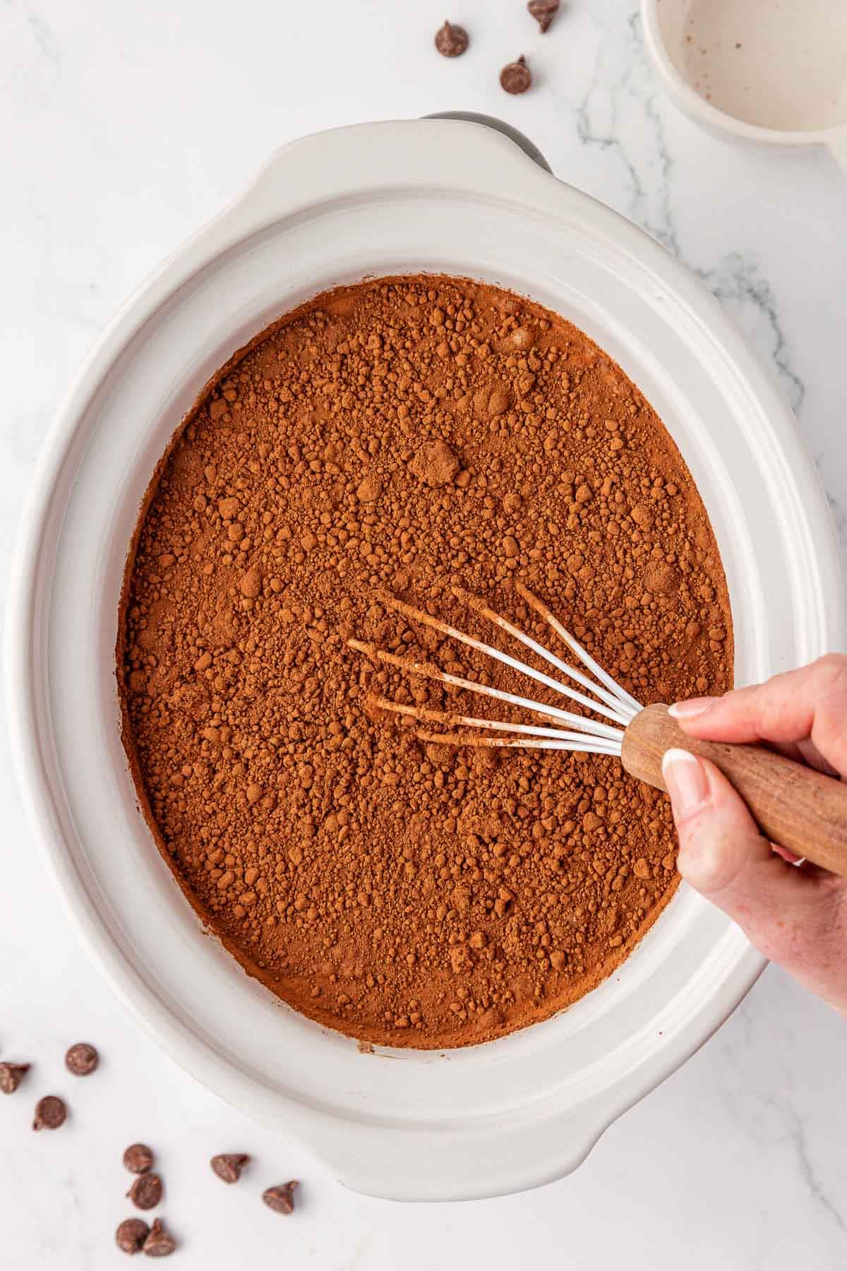 whisking the cocoa powder into the hot chocolate