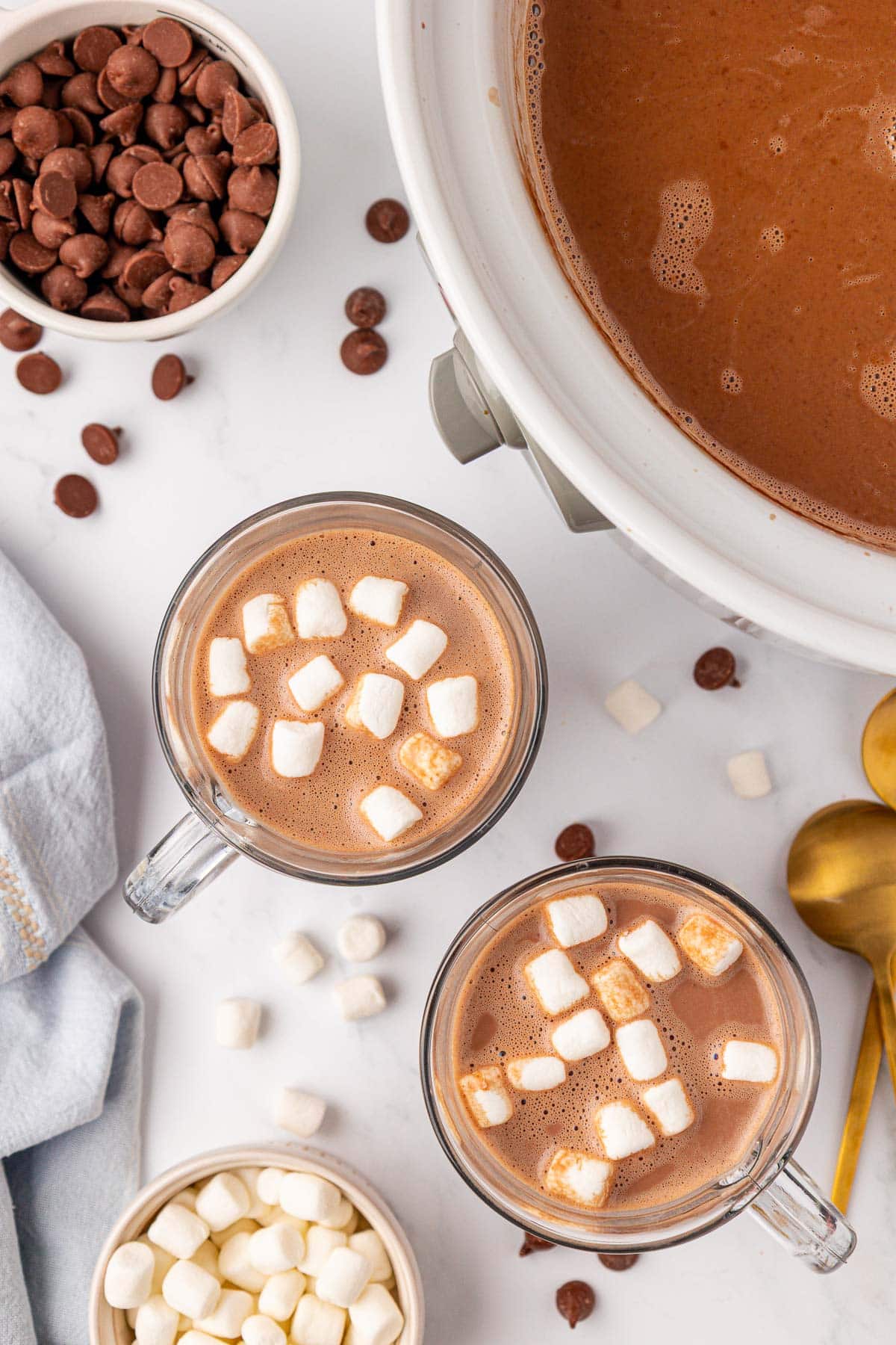 crock pot hot chocolate in a mug with mini marshmallows on top