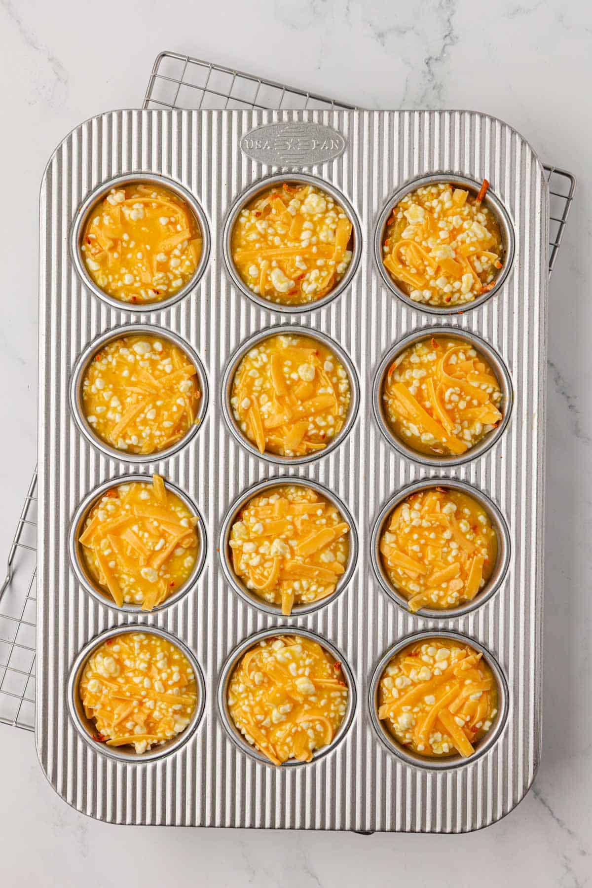 hash brown egg cups in the muffin tin before baking