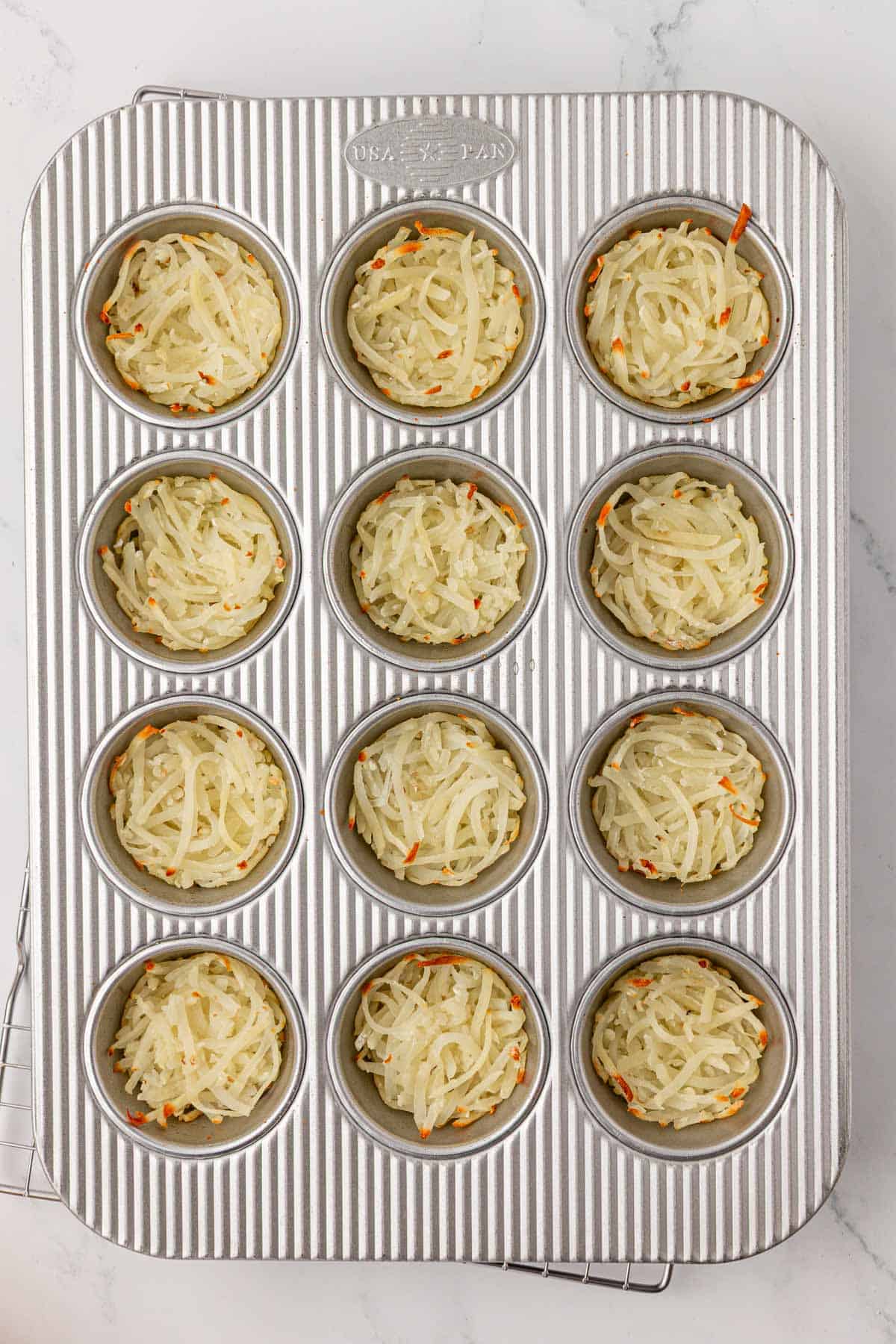 hash browns in a muffin tin