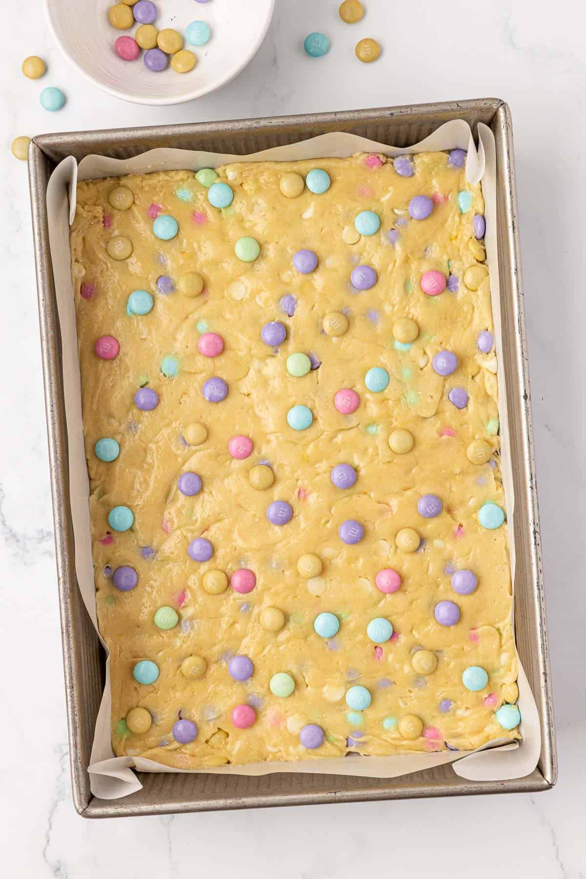 cookie bar batter topped with Easter m&m's