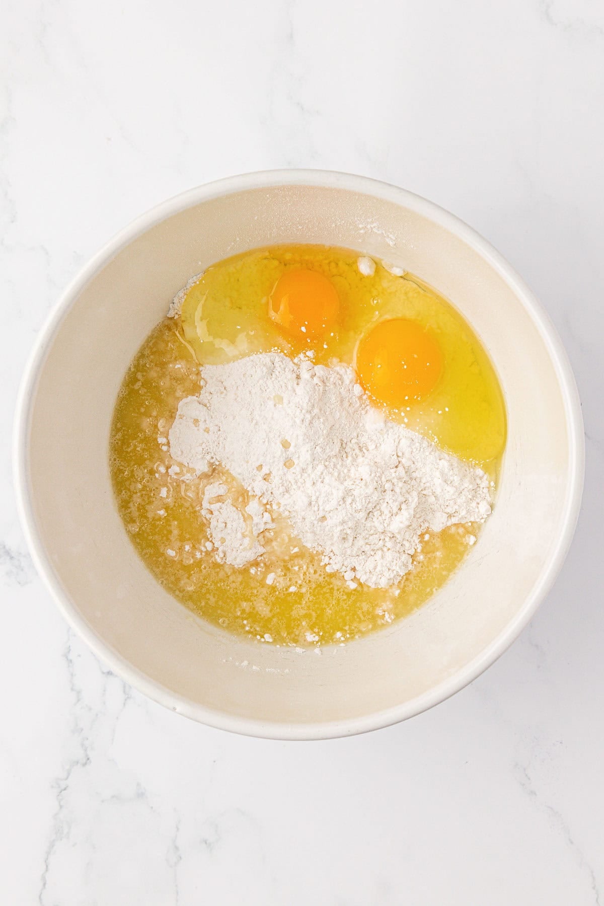 eggs, cake mix, and melted butter in a mixing bowl