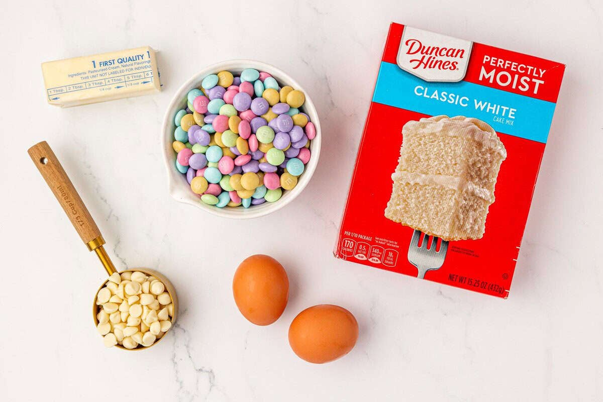 butter, white chocolate chips, Easter m&m's, eggs, and vanilla cake mix