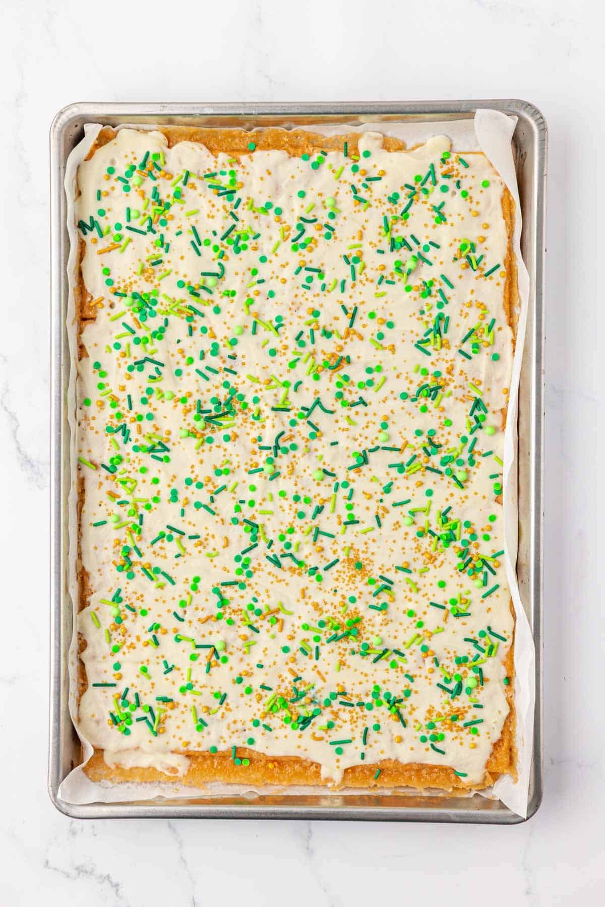 adding the sprinkles over the melted white chocolate