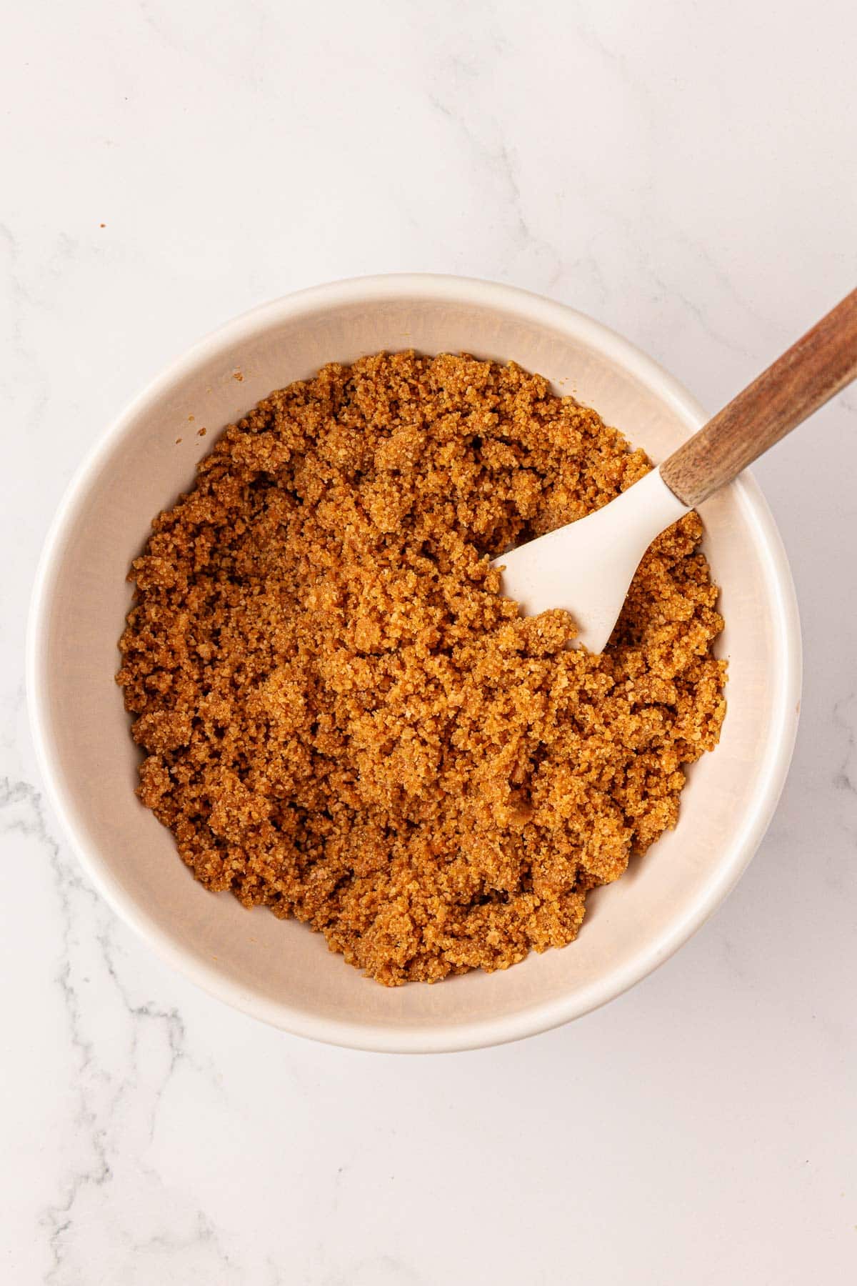 graham cracker crust in a mixing bowl