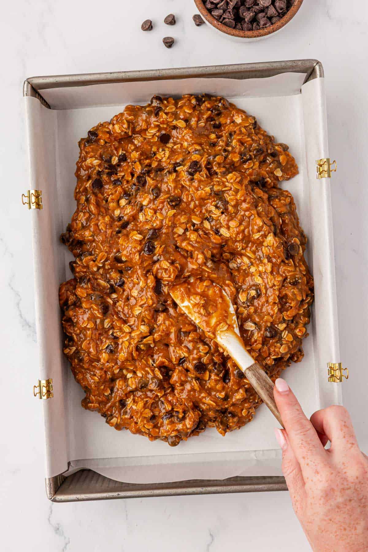 spreading the batter into a baking dish