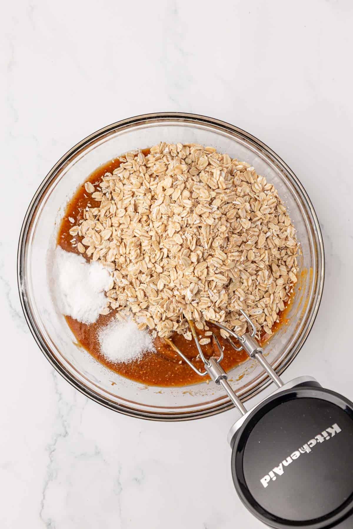 adding the dry ingredients to the mixing bowl