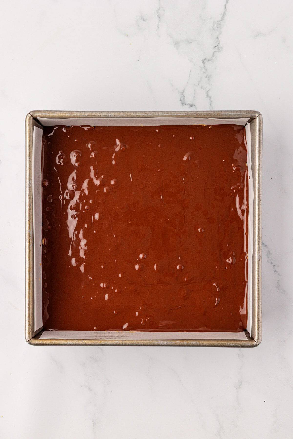 melted chocolate smoothed over the top of the rice krispies