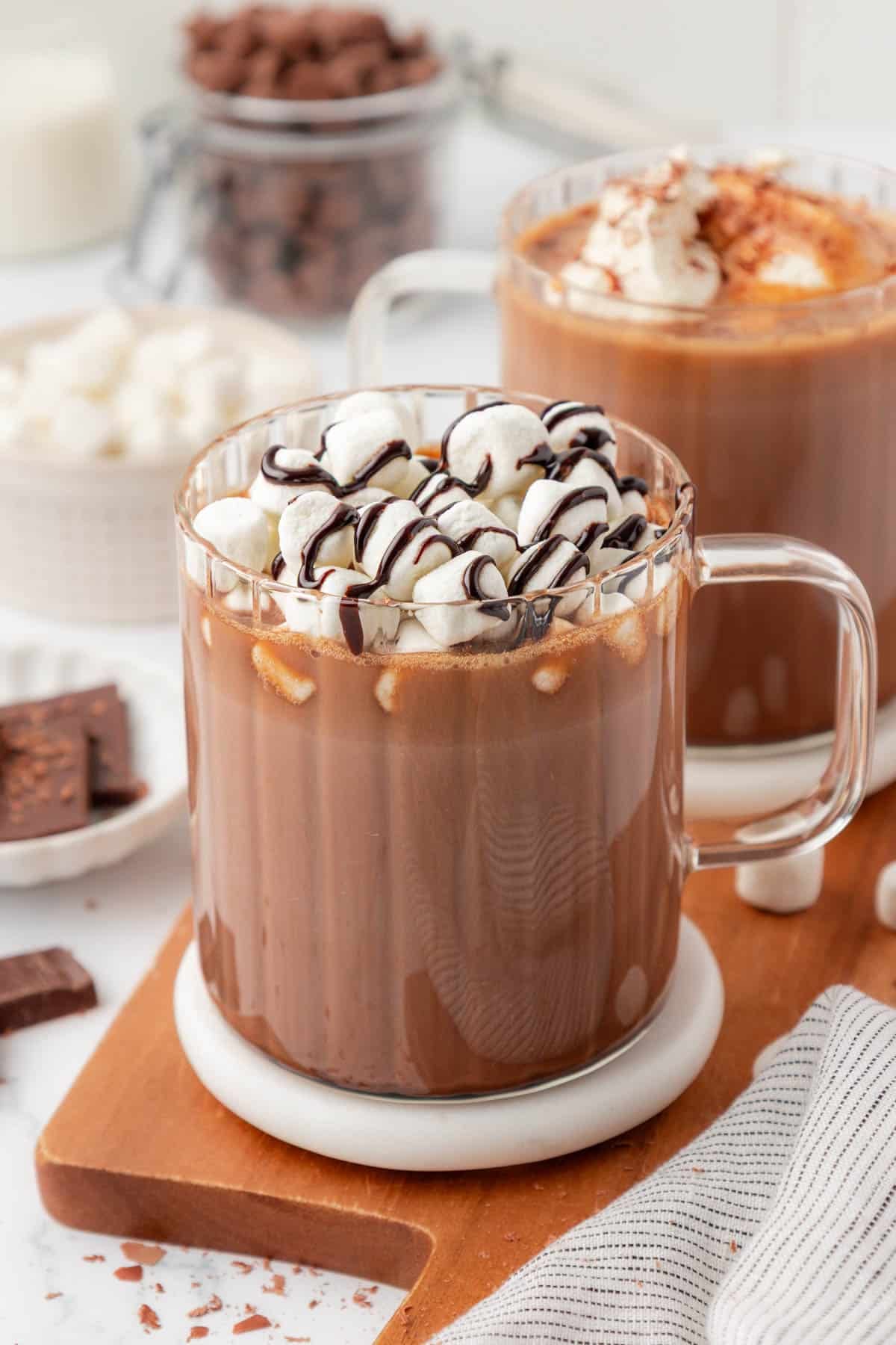 hot chocolate topped with marshmallows and chocolate syrup