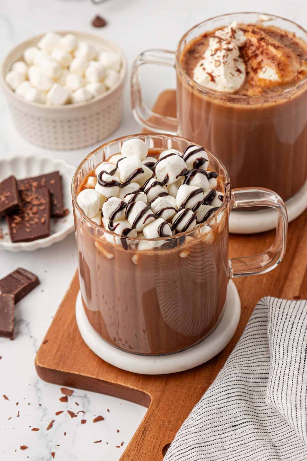 hot chocolate topped with marshmallows and chocolate syrup