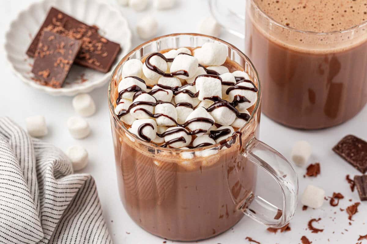 hot chocolate topped with marshmallows and chocolate syrup