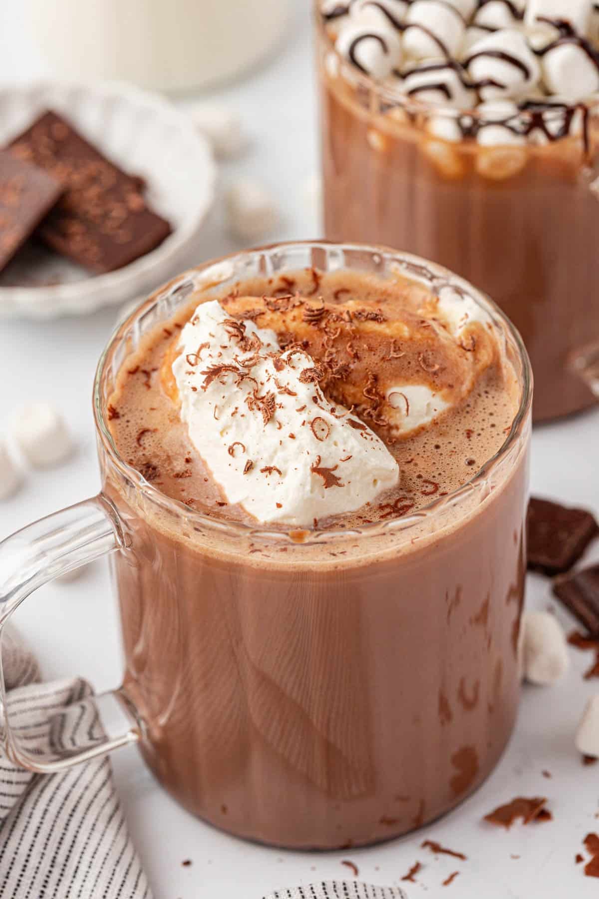 hot chocolate topped with whipped cream and chocolate shavings