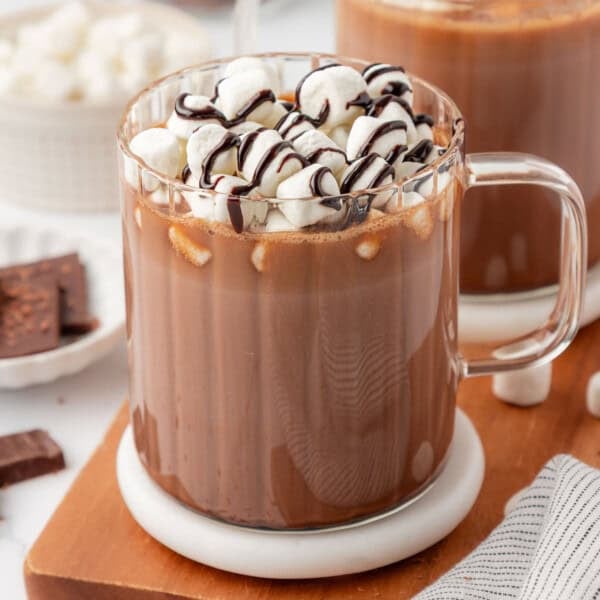 hot chocolate topped with marshmallows and chocolate syrup