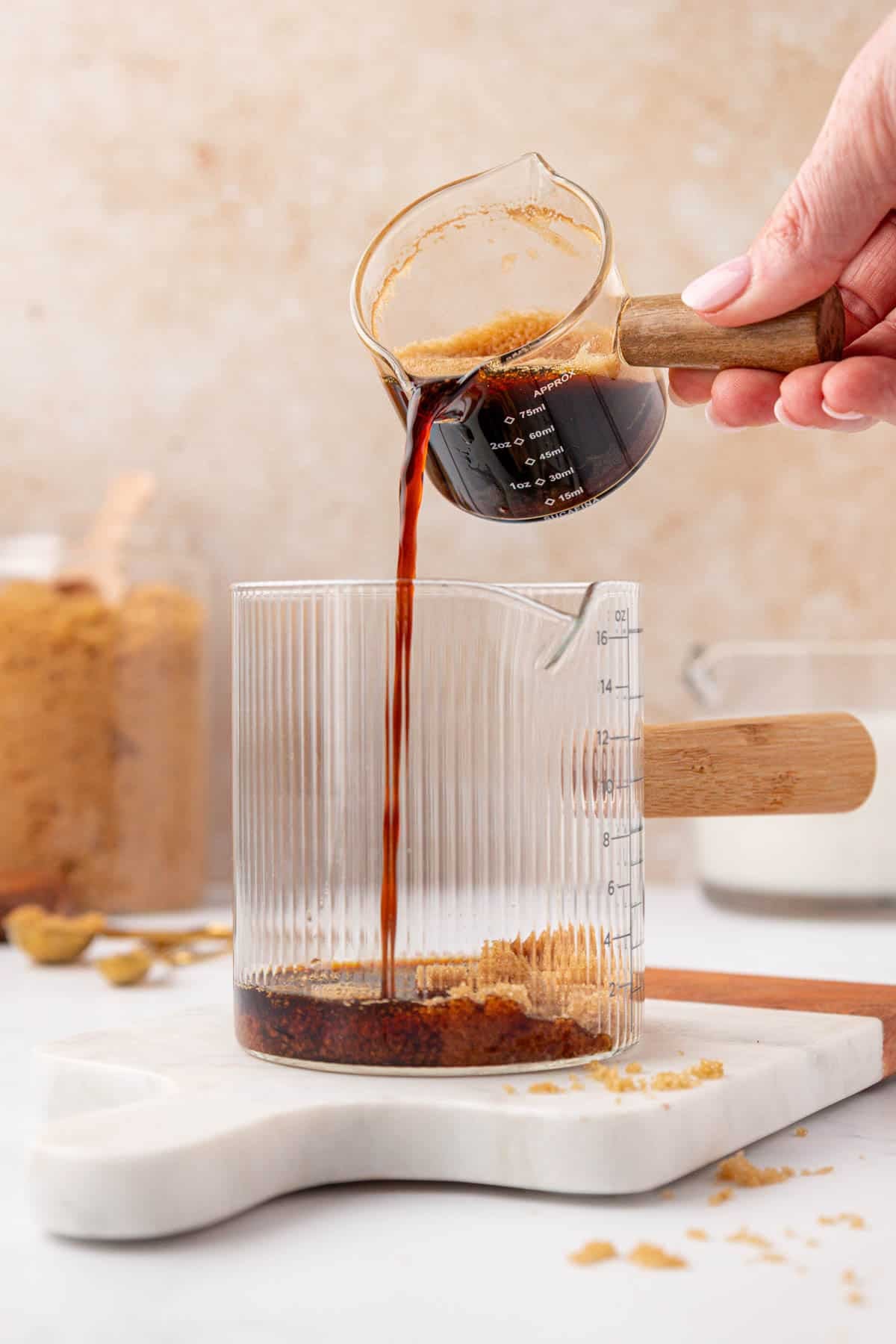 pouring espresso into a container