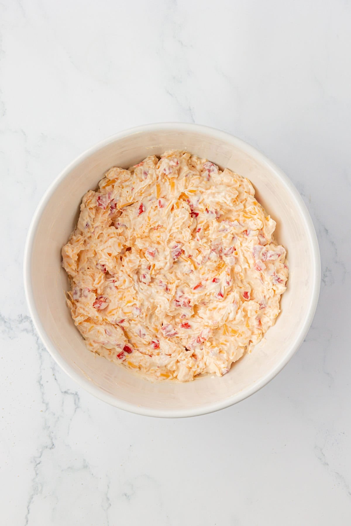 pimento cheese dip in a mixing bowl