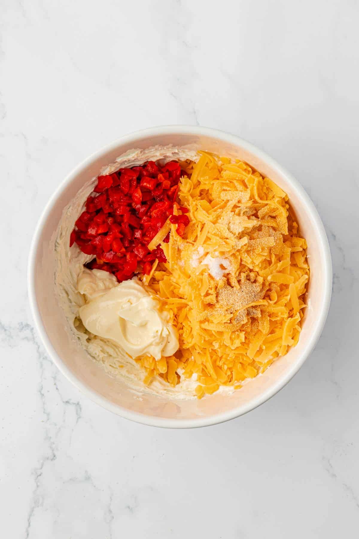 pimento cheese dip ingredients in a mixing bowl