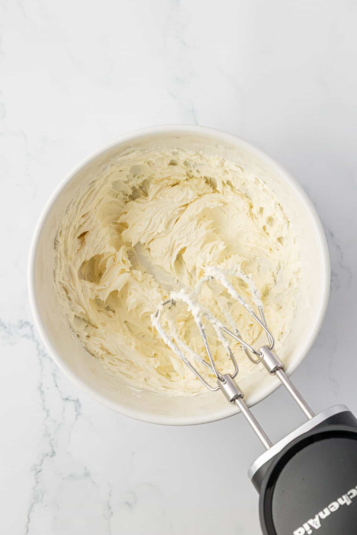 cream cheese mixed together in a mixing bowl