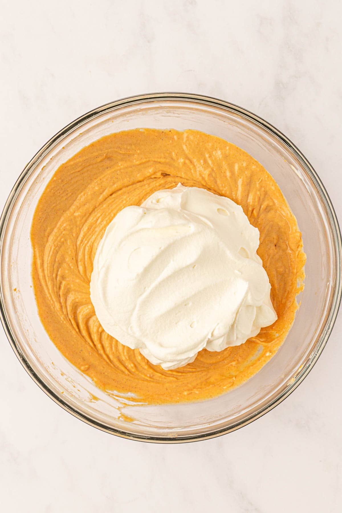 adding the whipped cream to the pumpkin cream cheese mixture