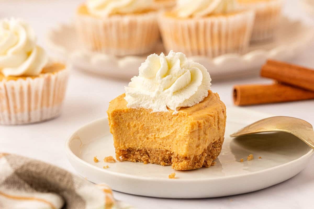 no bake mini pumpkin cheesecake topped with whipped cream