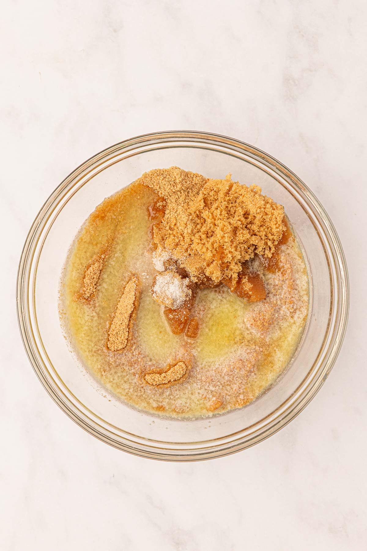 ingredients for the graham cracker crust in a mixing bowl