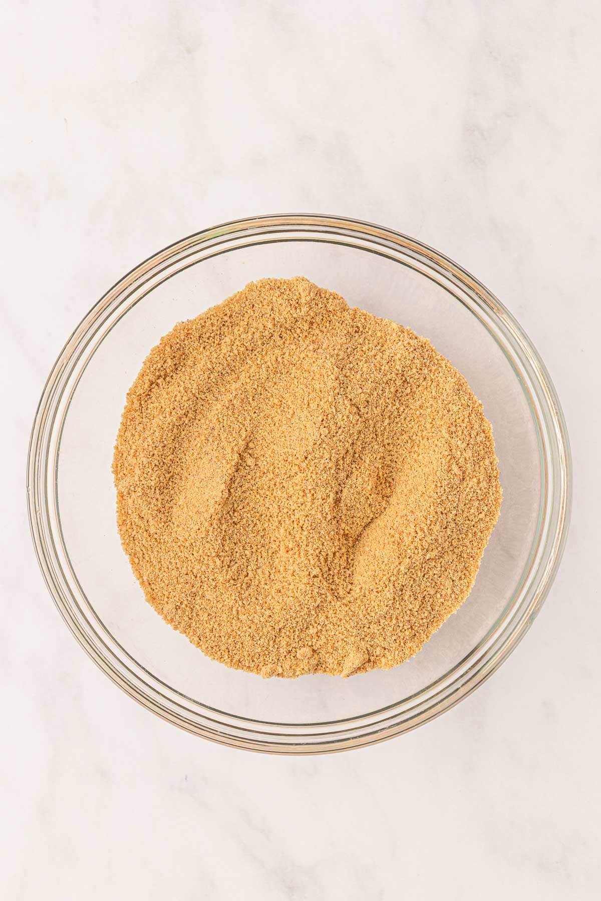 crushed graham cracker crumbs in a mixing bowl