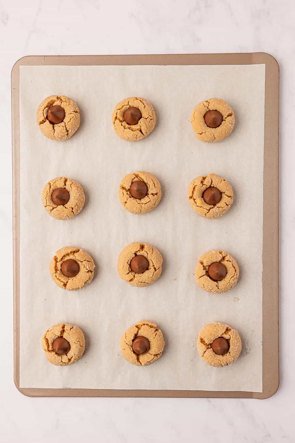 cake mix peanut butter blossoms on a baking sheet