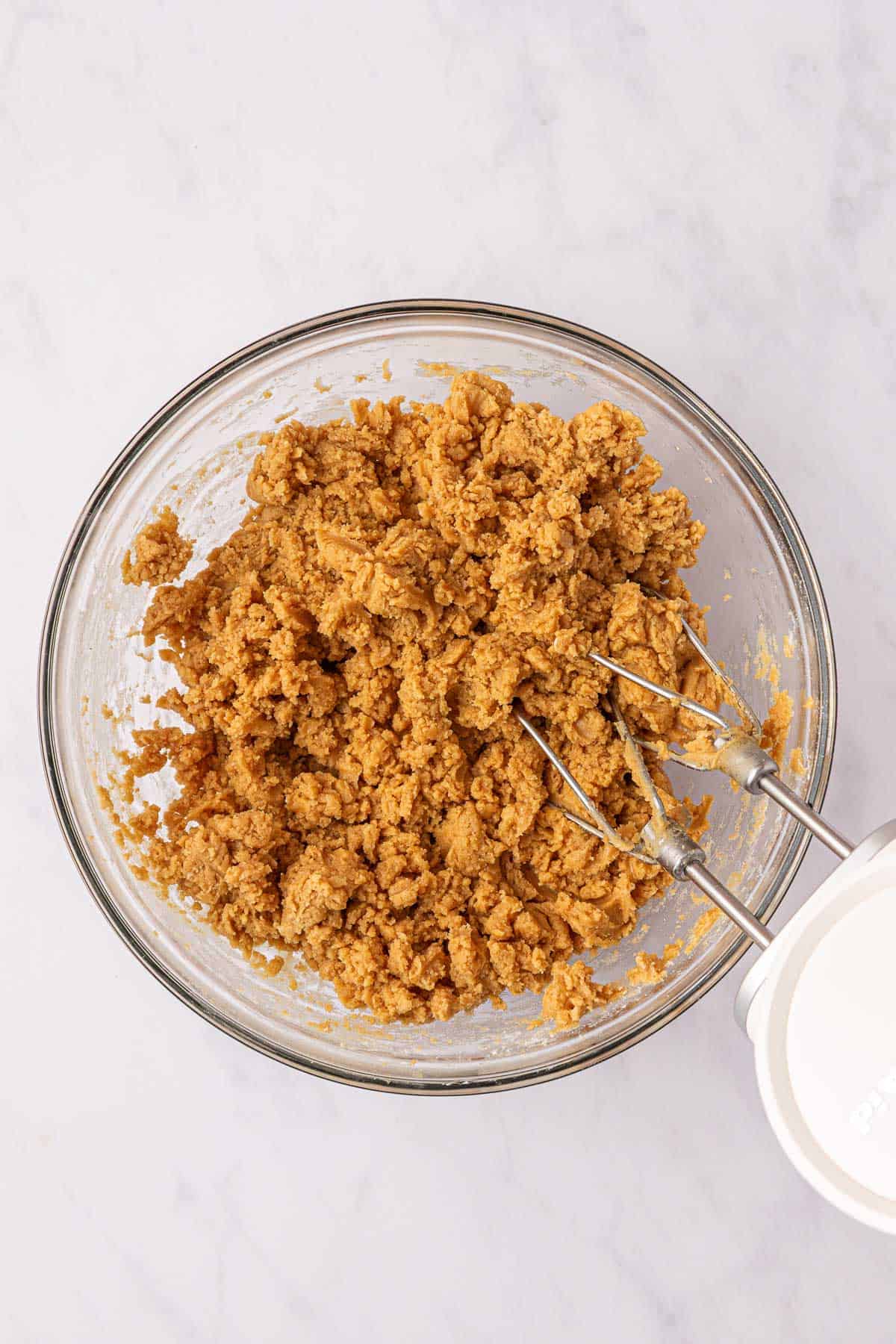peanut butter cookie batter in a mixing bowl