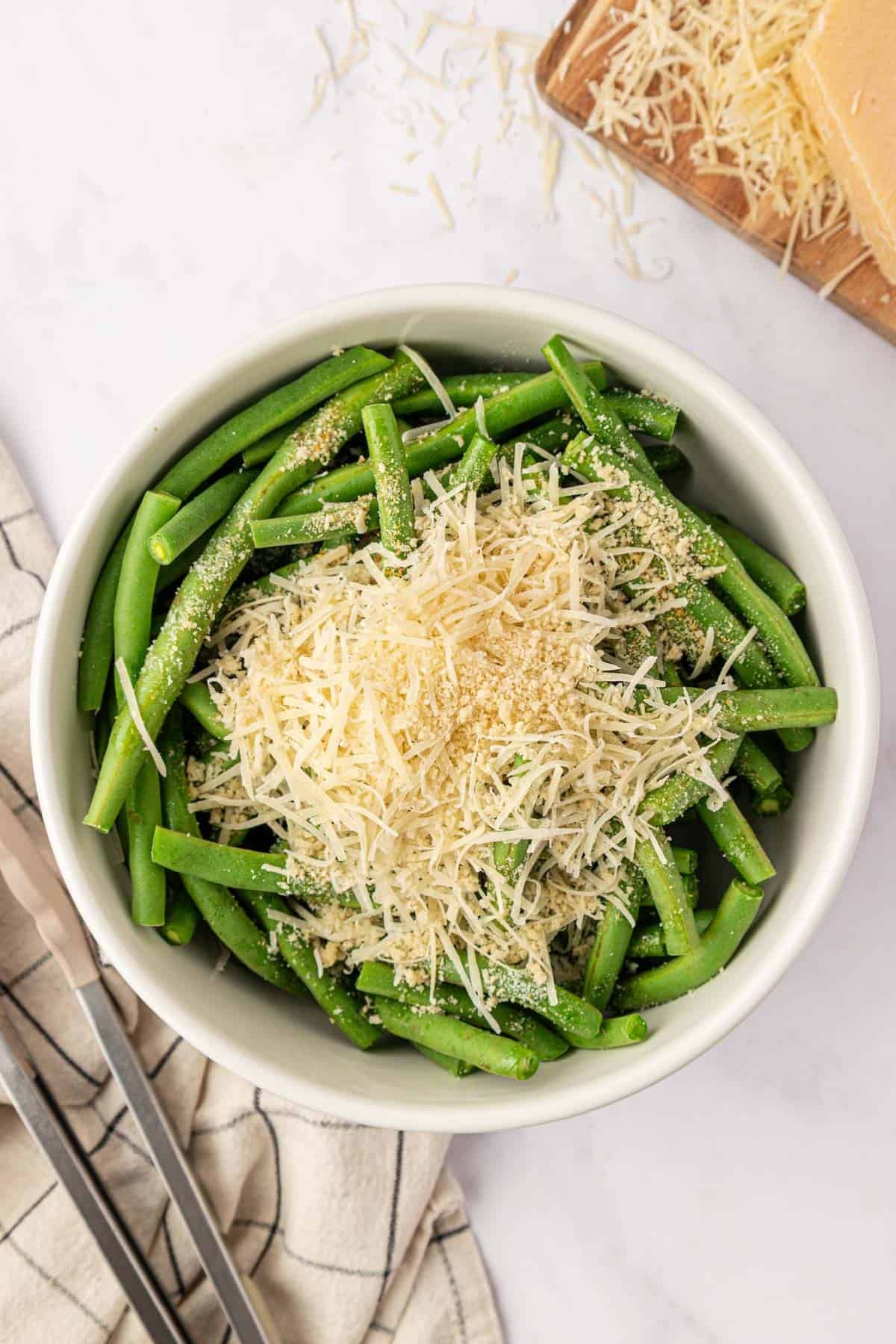 green beans, parmesan, and spices in a bowl